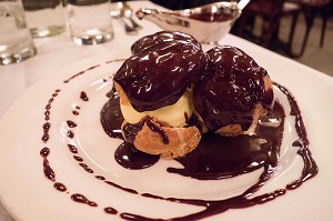 Profiteroles with vanilla ice cream and chocolate sauce Balthazar New York